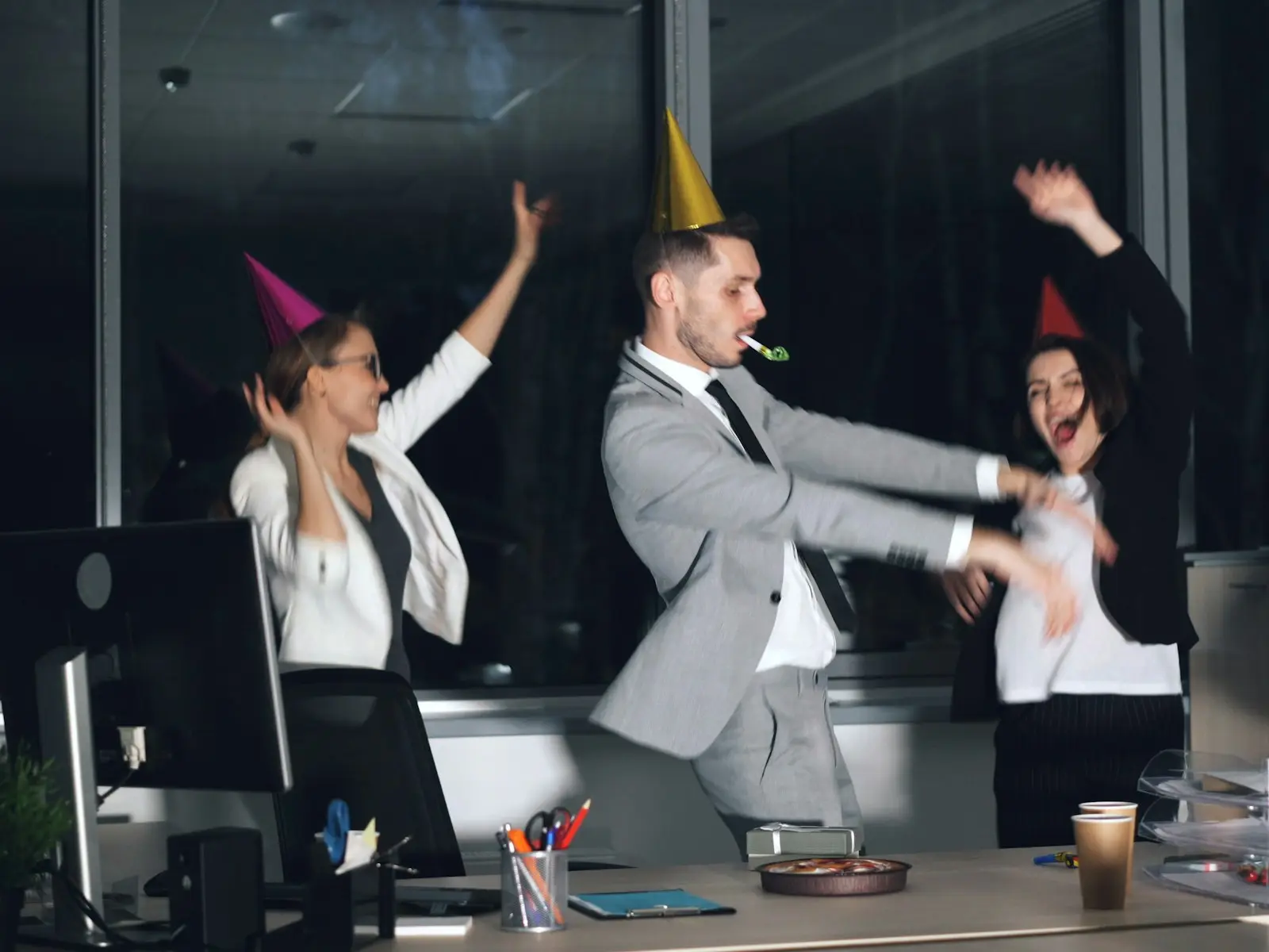 Colleagues celebrating together in the office