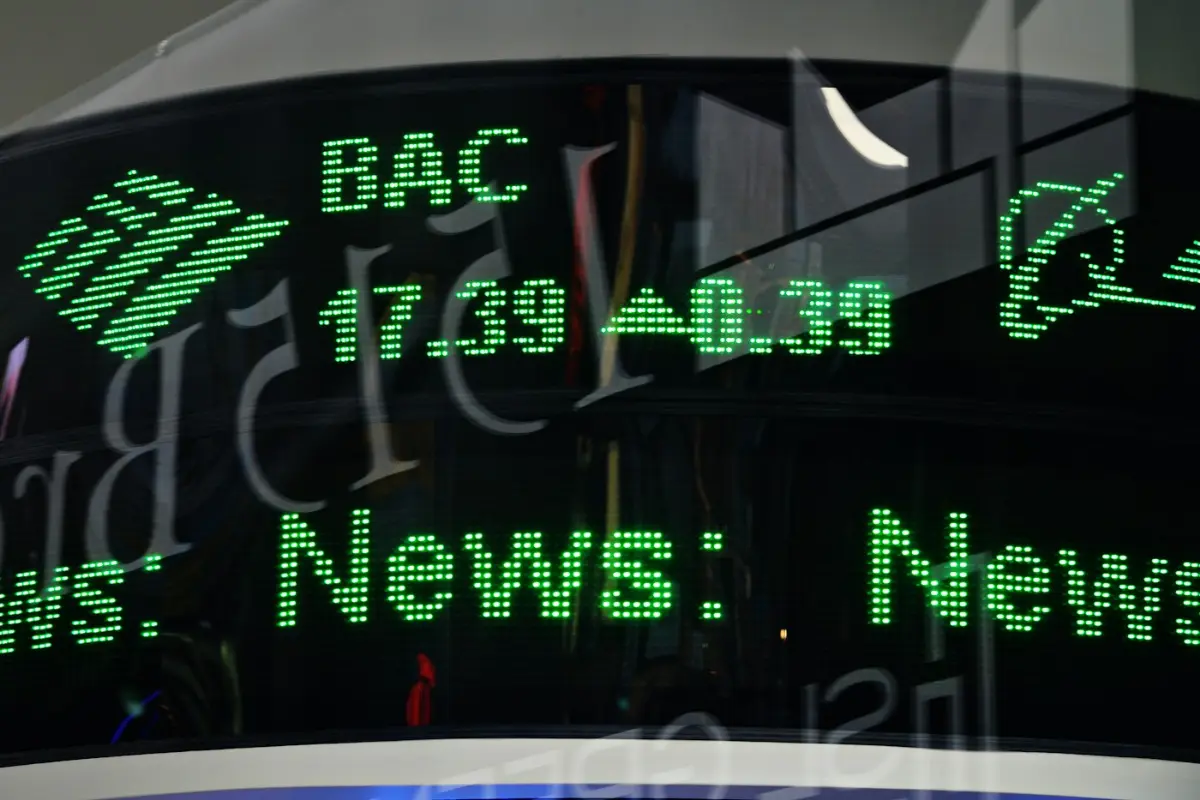 A close up of a clock with green numbers