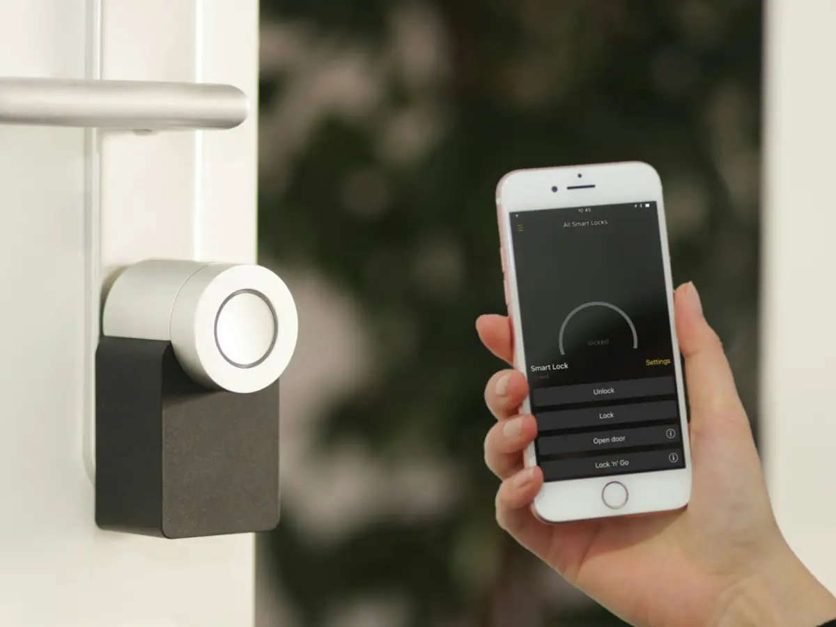 A smart door lock opened from a phone, illustrative